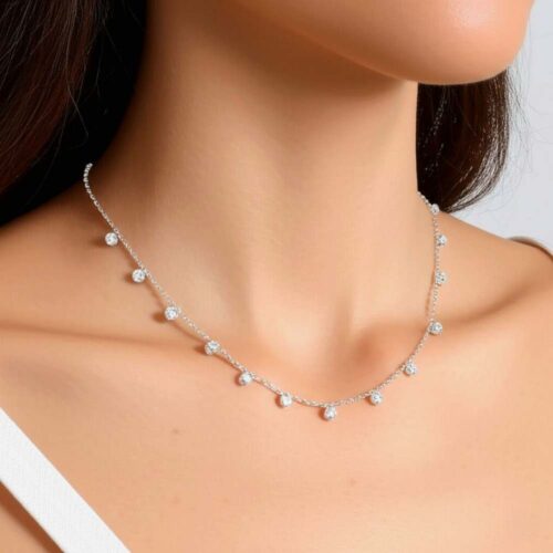 Model wearing silver queen necklace