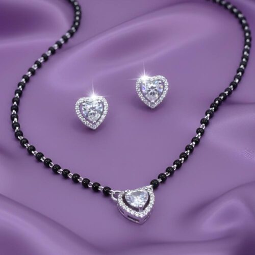Heart shape silver mangalsutra with solitaire pendant worn for elegant occasions