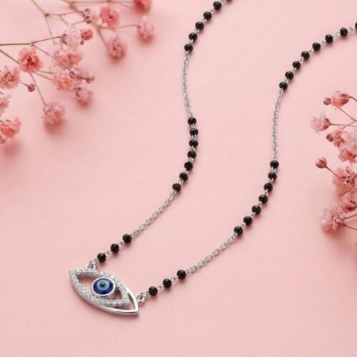 Silver Evil Eye Mangalsutra with black beads chain on soft pink background