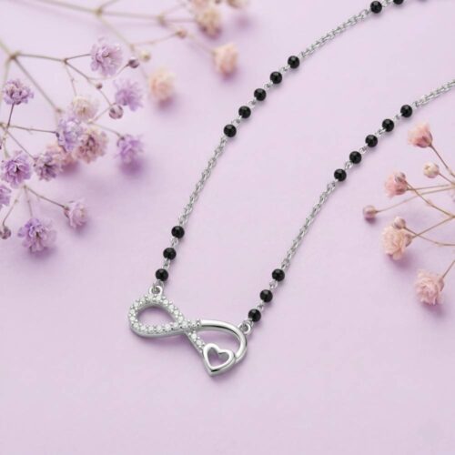 silver infinity heart mangalsutra necklace elegant flatlay design