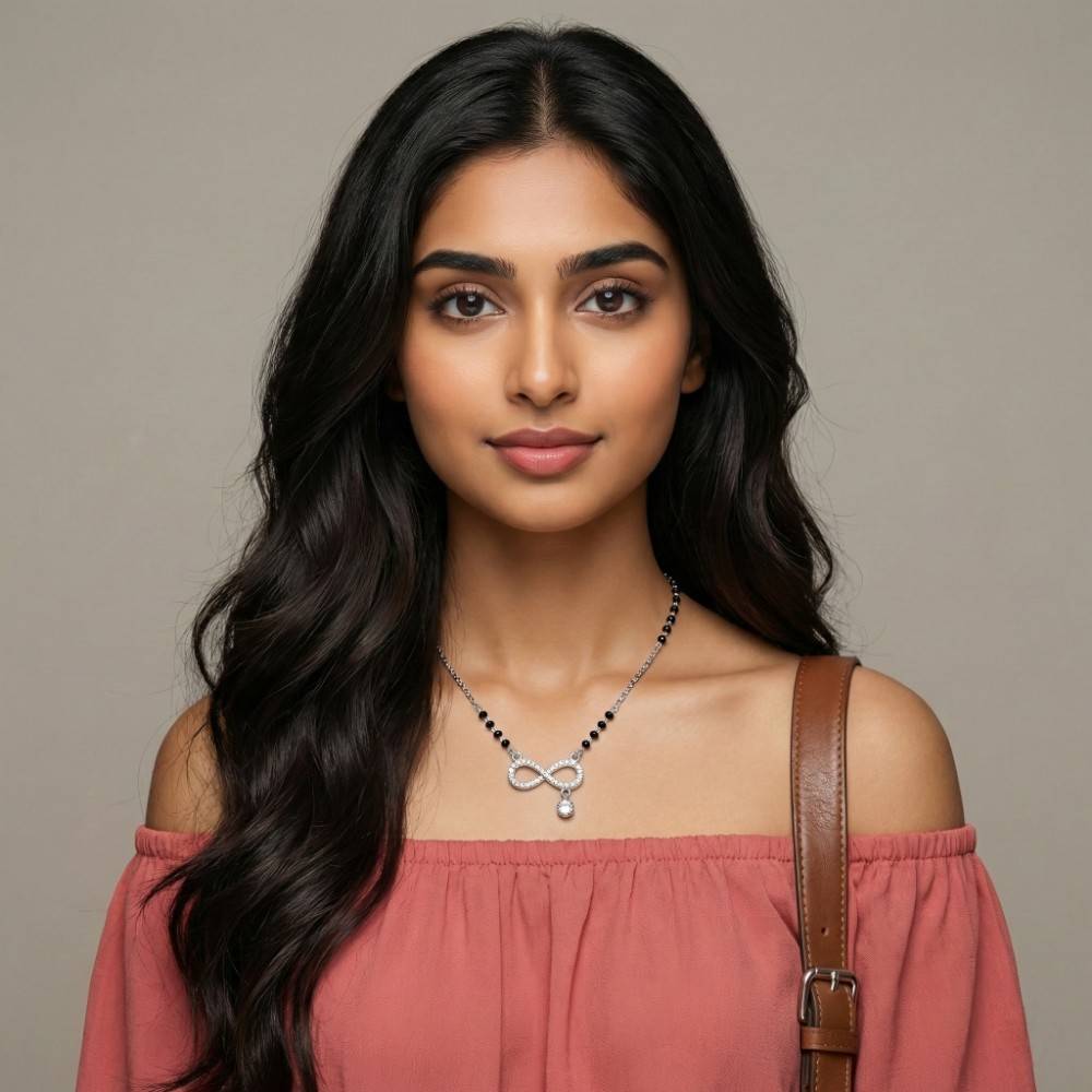 925-silver-infinity-mangalsutra-worn-look Young girl wearing stylish Silver Infinity Drop Mangalsutra with off-shoulder top