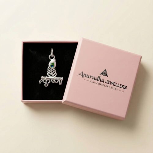 The beautiful standalone Krishna Morpankh Pendant presented securely inside a premium pink Anuradha Jewellers gift box.