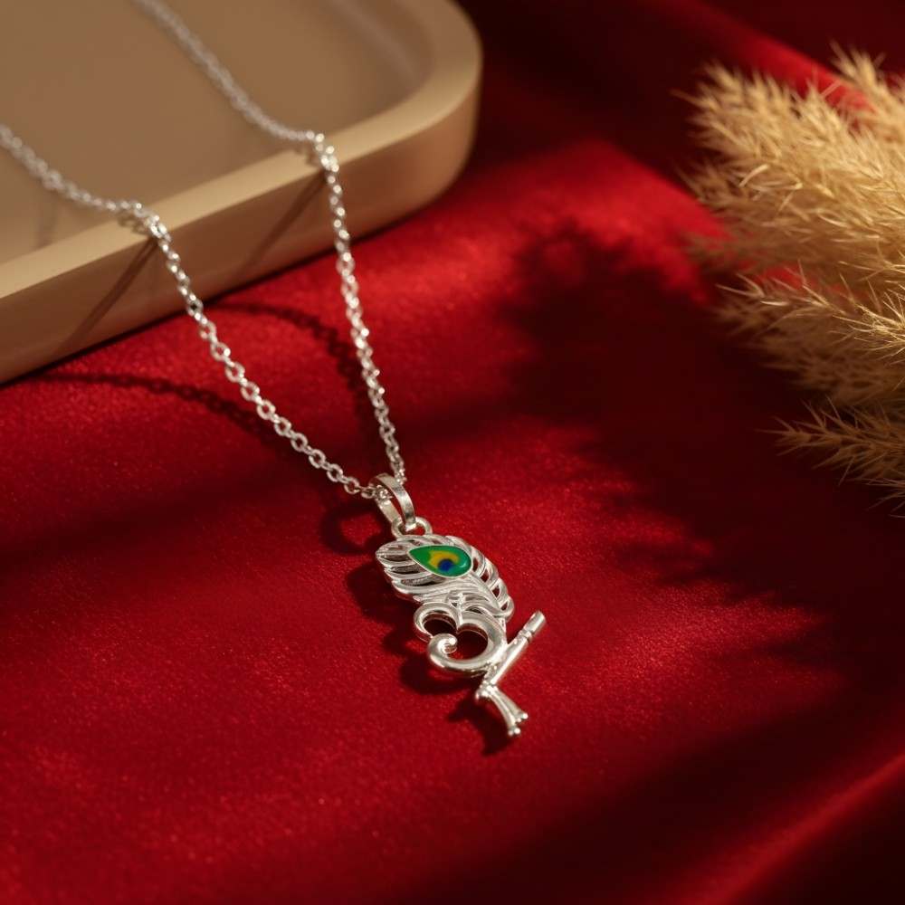 krishna-peacock-feather-pendant-necklace-premium-lifestyle Krishna peacock feather pendant necklace with flute and Om symbol in premium lifestyle setting