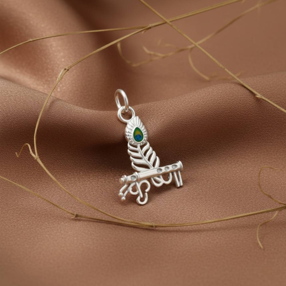 mor-pankh-pendant-silver-lifestyle-shot Mor Pankh pendant silver with peacock feather design displayed on premium fabric background