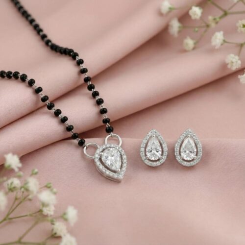 Silver tear drop mangalsutra with solitaire pendant and matching earrings