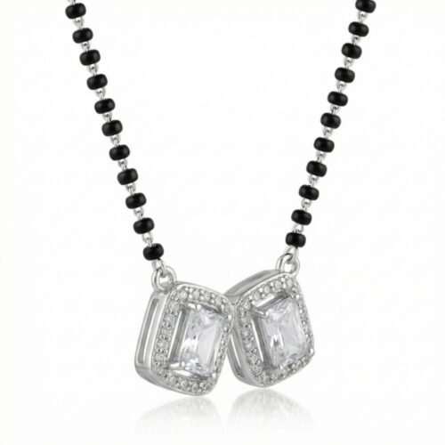 Close up of twin emerald cut halo CZ stones in silver mangalsutra pendant