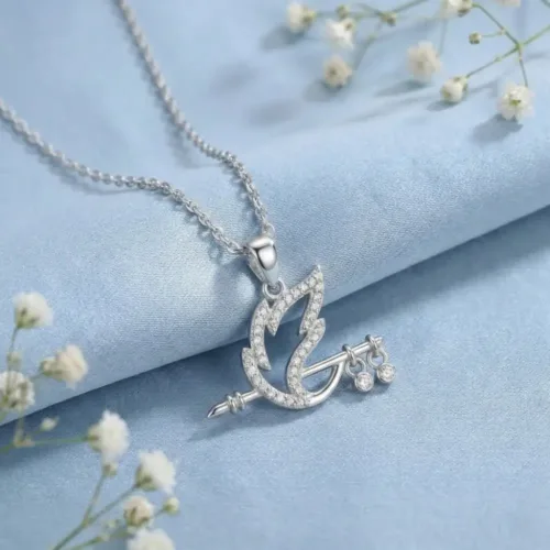 Elegant Shree Krishna Bansuri Necklace placed on a light blue fabric with white flowers