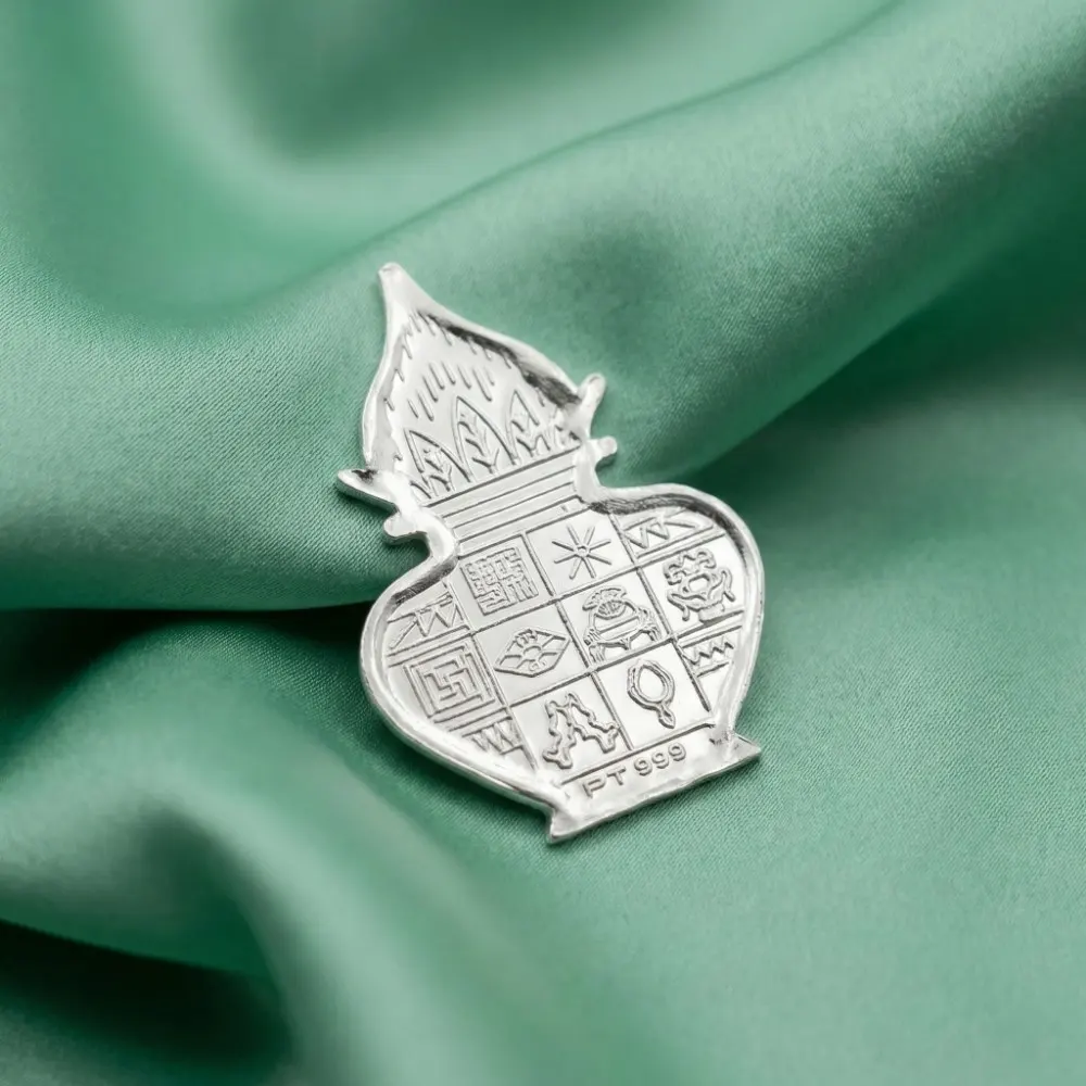 Close Up of 1 Gram Silver Kalash 999 Pure Silver Close up view of 1 gram silver kalash made from 999 pure silver with detailed traditional kalash design