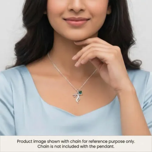 Woman gracefully styling the silver krishna locket on her neckline. Displayed with a chain for reference purpose only, chain not included.