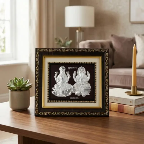 999 pure Silver Laxmi Ganesh Frame placed elegantly on a wooden table for home mandir and decor