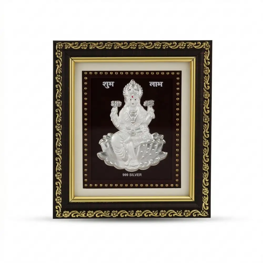 Buy 999 Pure Silver Laxmi Idol Frame Online Front view of authentic 999 pure Silver Laxmi Frame featuring Shubh Labh to attract wealth