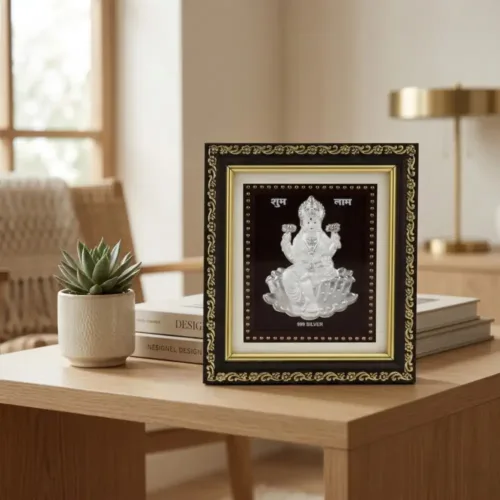 999 pure Silver Laxmi Frame placed elegantly on a wooden table for Vastu and home mandir decor