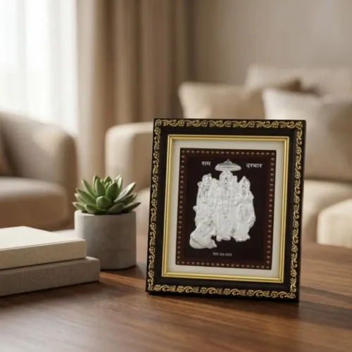 Beautiful pure silver ram darbar frame for home mandir placed elegantly on a wooden table
