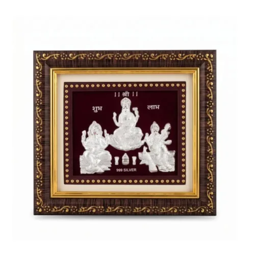 Front view of handcrafted 999 pure silver laxmi ganesh saraswati frame showcasing the divine trimurti