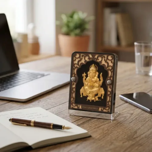 Beautiful large 24kt gold ganesh frame placed elegantly on an executive office desk to attract success