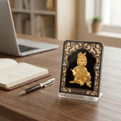 Beautiful 24kt gold laddu gopal frame placed elegantly on a desk to bring divine blessings and joy