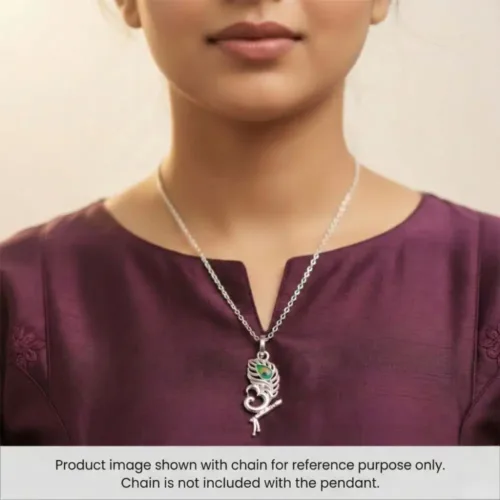 Woman elegantly styling the Silver Krishna Om Pendant. Displayed with a chain for reference only; chain is not included with the standalone pendant.