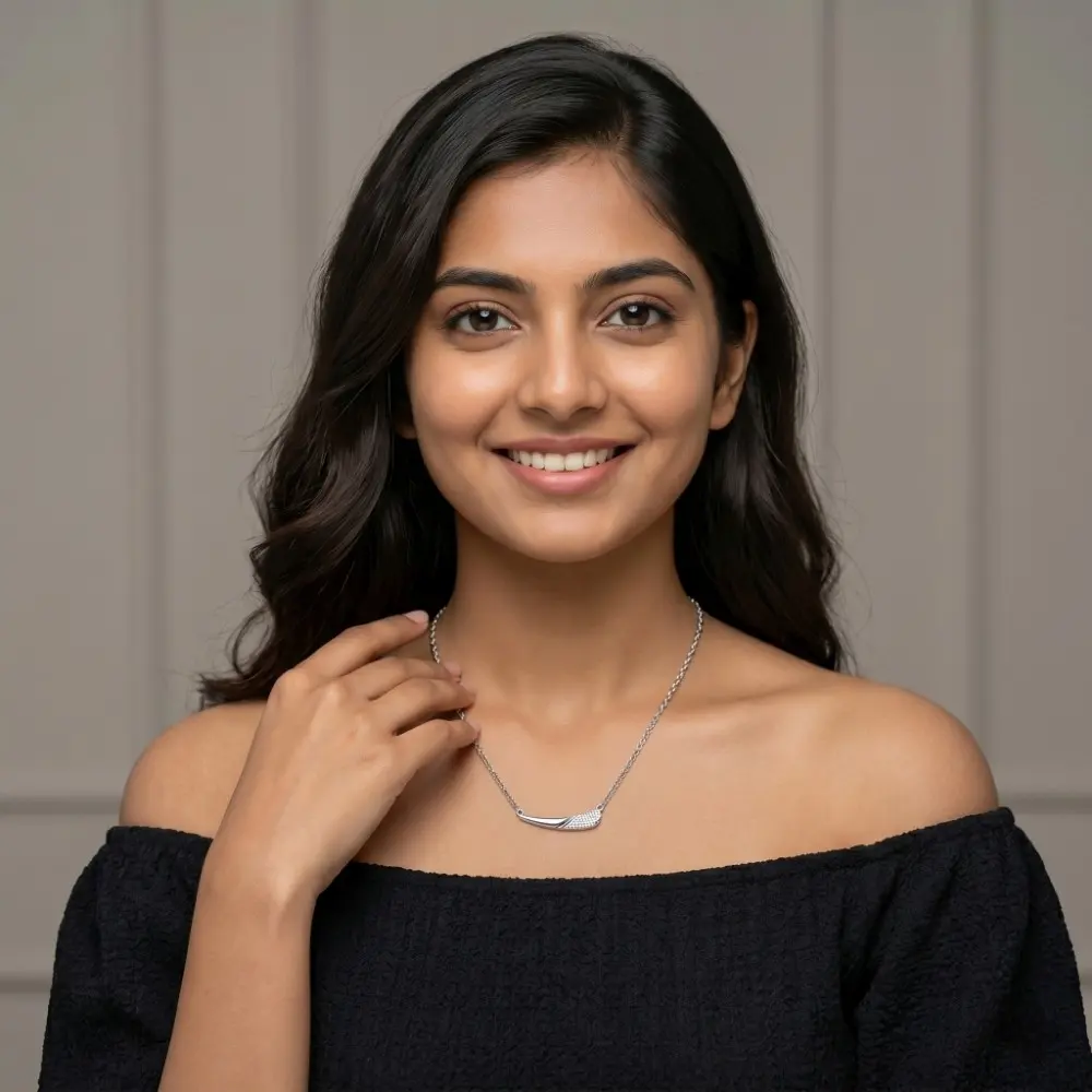 Minimalist Silver Necklace on Model Elegant Indian professional wearing the minimalist silver necklace for office wear paired with a black top