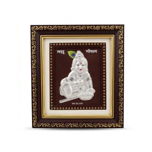 Close up front view of the 999 pure silver laddu gopal frame featuring intricate embossed details