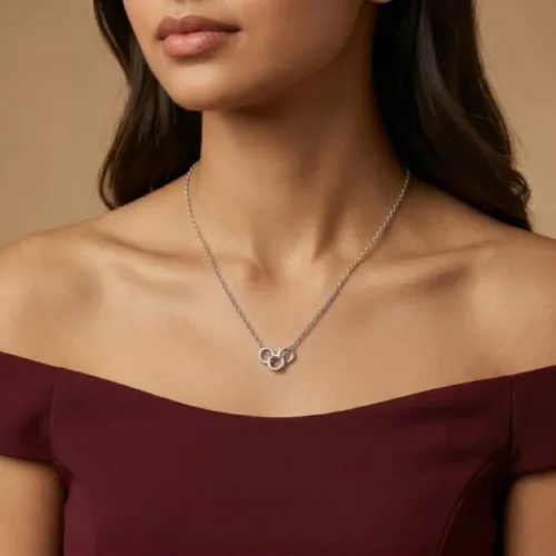 Stylish woman showcasing the minimalist daily wear silver necklace featuring three linked circles