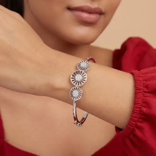 Elegant model wearing the stunning triple circle silver bracelet, showcasing its comfortable fit and radiant architectural design on the wrist.