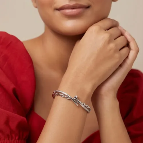 Model effortlessly wearing the bold nail bracelet silver women love, highlighting the striking architectural appeal on the wrist.