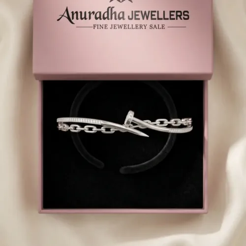 The stunning edgy silver nail cuff securely packaged inside the signature pink Anuradha Jewellers gift box, ready to be presented as a luxury gift.