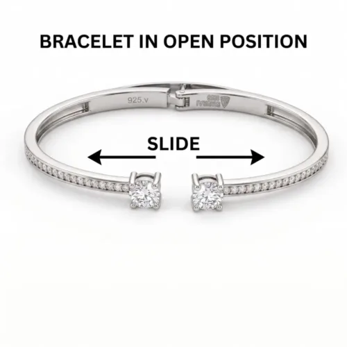 Infographic demonstrating the silver hinged bangle bracelet in an open position, clearly illustrating the practical slide mechanism for easy and comfortable wear.