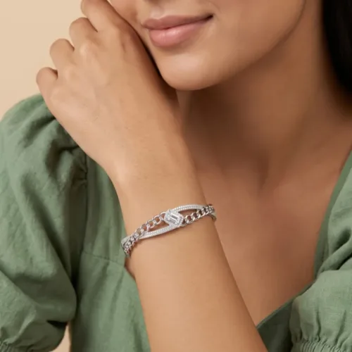 Elegant model wearing the criss cross silver cuff bracelet, showcasing its modern multi-dimensional look and comfortable fit on the wrist.