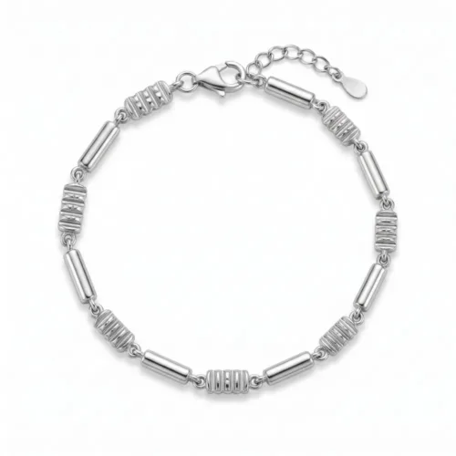 Minimalist silver bar link bracelet for women featuring an alternating geometric tube and textured bead design on a white background.
