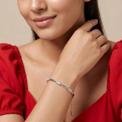 Woman wearing a highly versatile, minimalist silver bracelet for women, showcasing the comfortable everyday fit and sleek geometric design.
