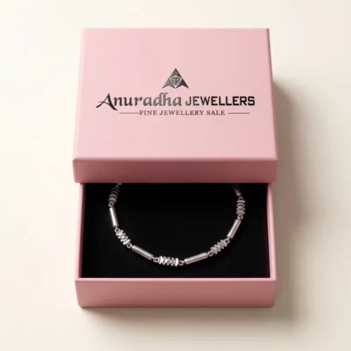 Geometric silver bar link bracelet securely placed inside the signature pink Anuradha Jewellers gift box on black velvet, ready for gifting.