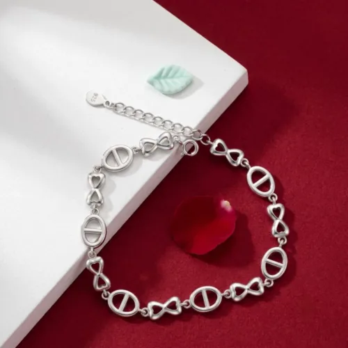 Elegant silver bow bracelet for women beautifully displayed on a modern red and white background, showcasing its unique stone-free design.
