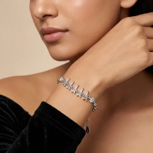 Woman modeling the parisian bracelet silver women look, showcasing the effortless fit and chic design of the silver eiffel tower bracelet on the wrist.