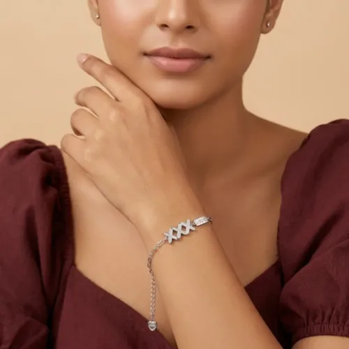 Woman wearing a romantic silver jewelry gift for her, showcasing the stylish and delicate fit of the love tag bracelet silver on the wrist.