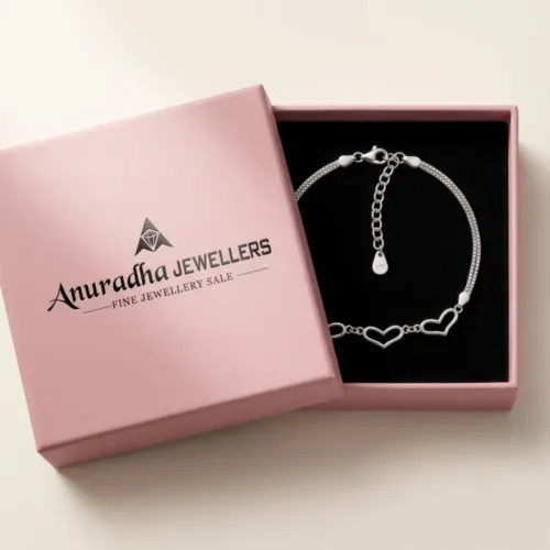 The premium silver open heart bracelet securely packaged inside the signature pink Anuradha Jewellers gift box, ready to be presented as a romantic gift.