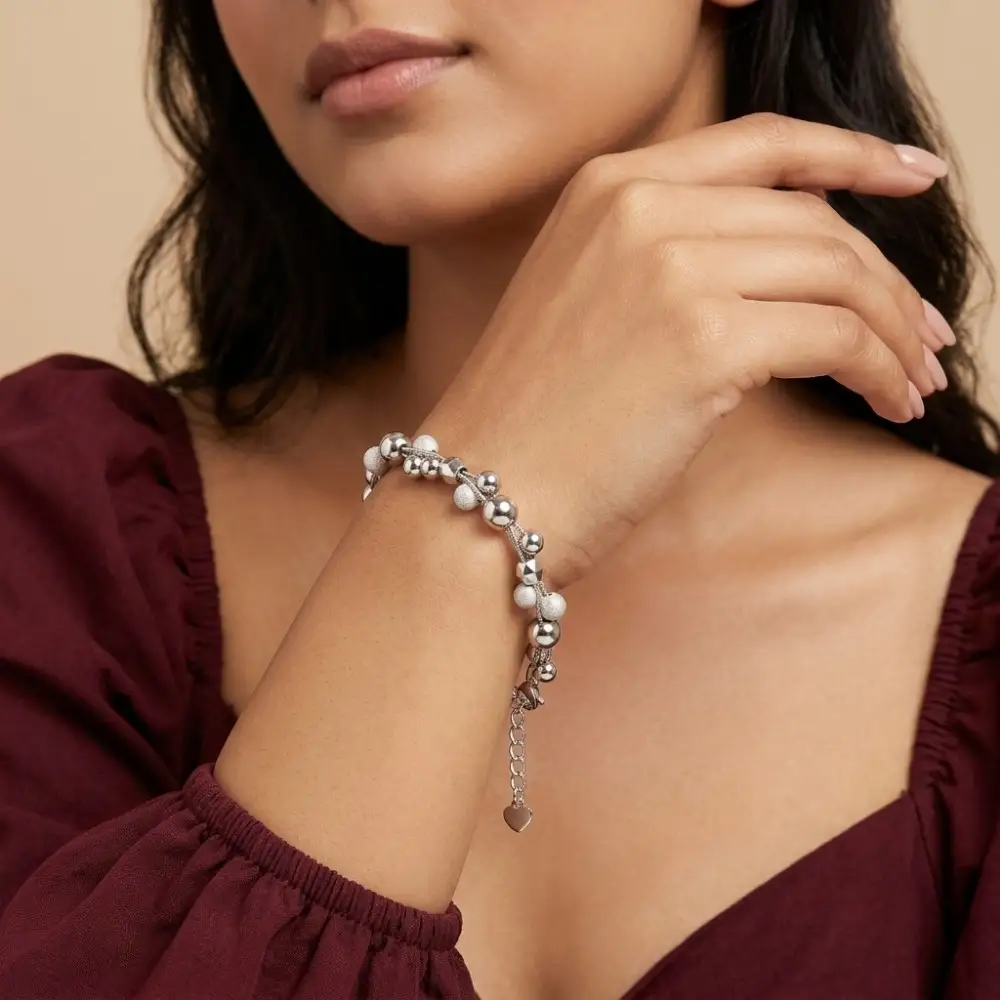 Stackable Silver Bead Bracelet Look Woman wearing the perfect silver ball bead bracelet women love, showcasing its effortless stackable silver bead bracelet look on the wrist.