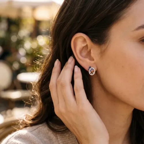 Elegant model wearing the small silver butterfly earrings, demonstrating their petite size, comfortable fit, and perfect look for everyday styling.