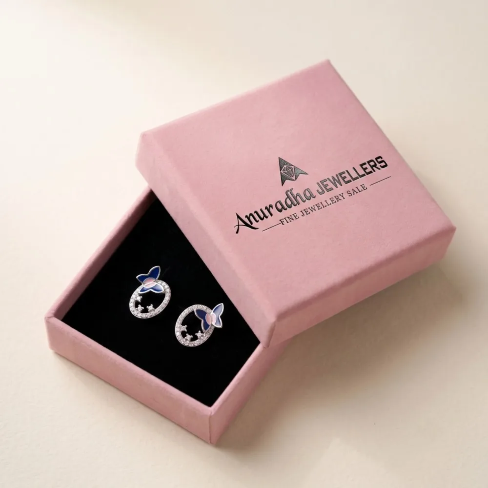 Silver Butterfly Earrings Gift Box The beautiful blue butterfly stud earrings perfectly presented inside the signature pink Anuradha Jewellers gift box on a black velvet cushion, completely ready for gifting.