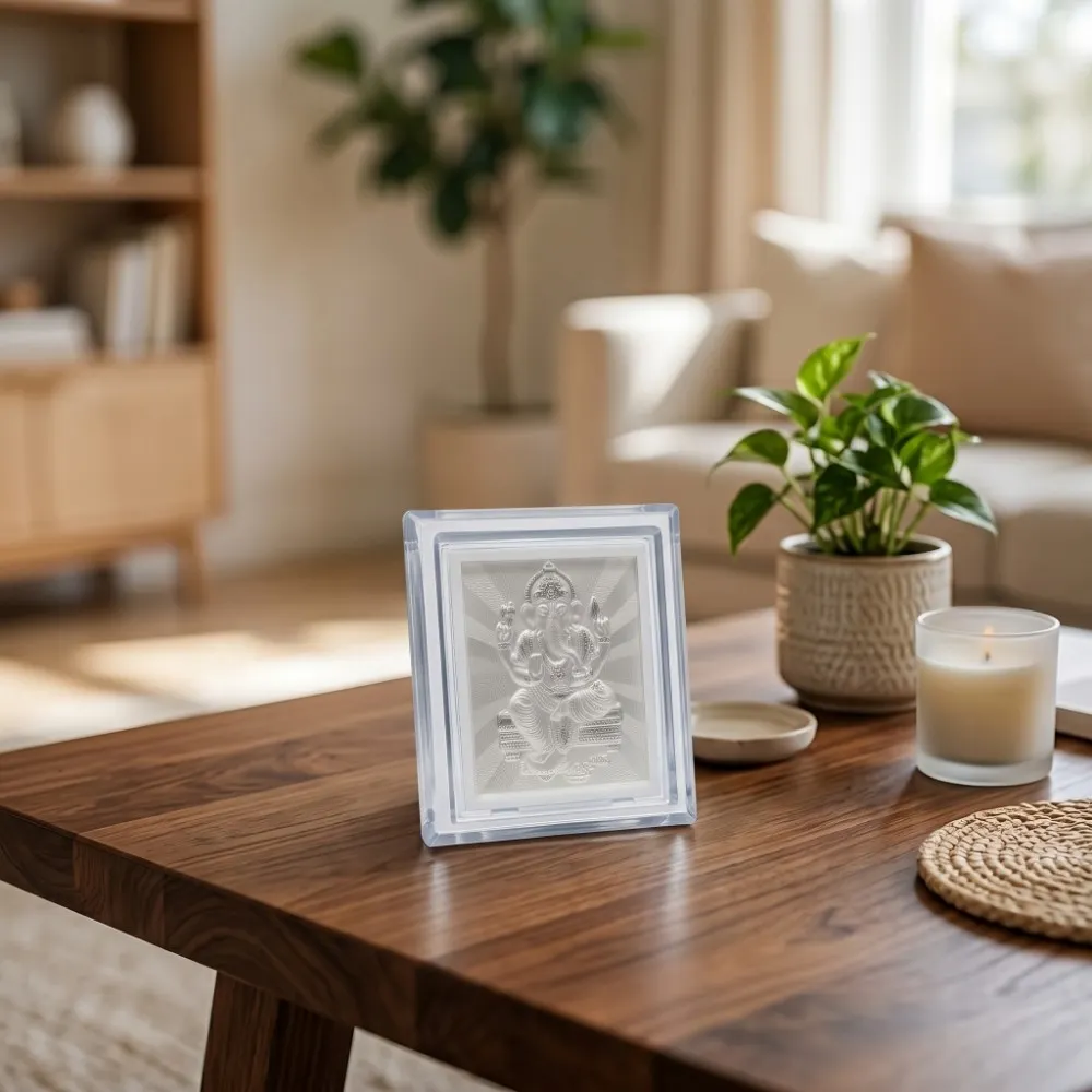 Tabletop Silver Ganesh Frame The acrylic silver ganesh frame placed elegantly on a wooden tabletop, showcasing its premium decor and gifting appeal.