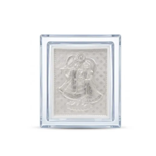 Front view of the small silver radha krishna frame in 999 pure silver, enclosed in a premium clear acrylic case.