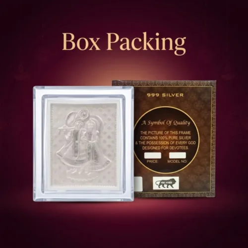The small silver radha krishna frame placed inside a premium gift box, making it an ideal silver radha krishna frame for return gift.