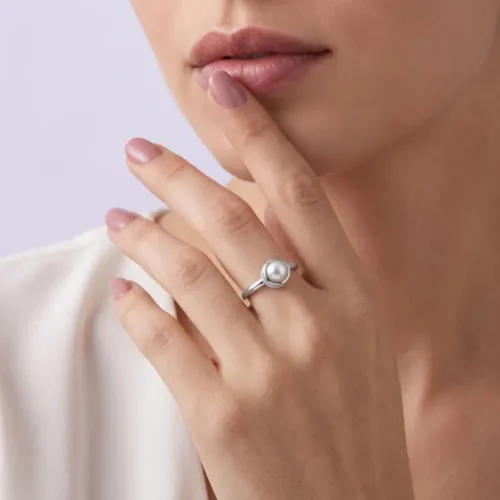 Elegant model wearing the classic daily wear pearl ring, demonstrating the sophisticated look and comfortable fit on the finger.