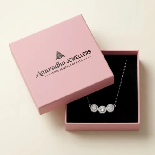 The modern ad mangalsutra design beautifully presented inside the signature Anuradha Jewellers pink gift box on a black velvet cushion, ready for premium gifting.